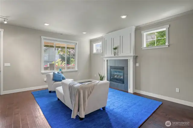 Open floorplan living area with fireplace