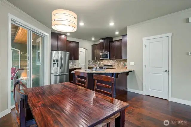Dinging area with easy access to kitchen, living room, and outside deck