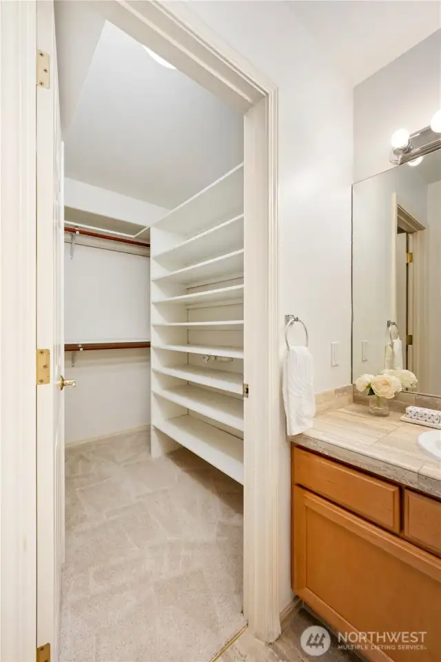 This walk-in closet provides plenty of room for all your wardrobe essentials.