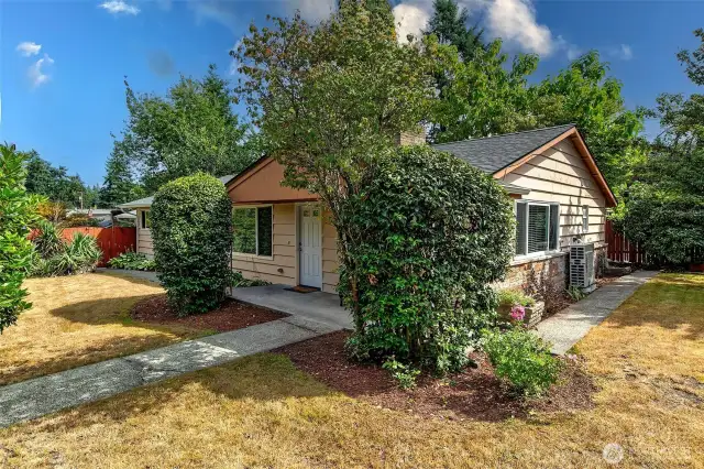 Completely updated level entry rambler on a corner lot.