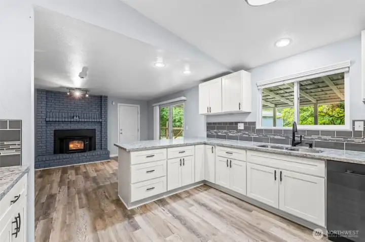 Newer gourmet kitchen with family room and eating bar.