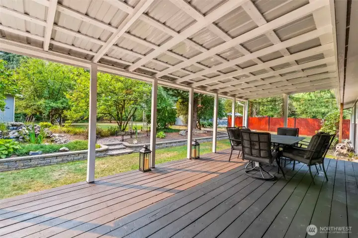 Huge covered deck off kitchen/family room overlooking lovely grounds