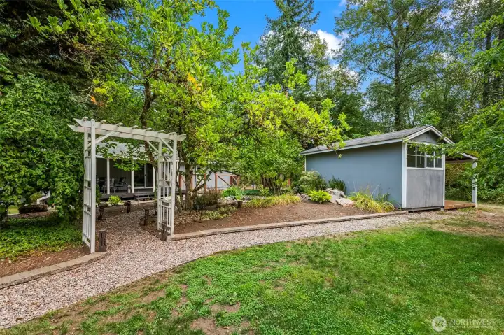 Another view of the peaceful, beautifully landscaped back yard where deer, rabbits, and pheasants, etc. roam