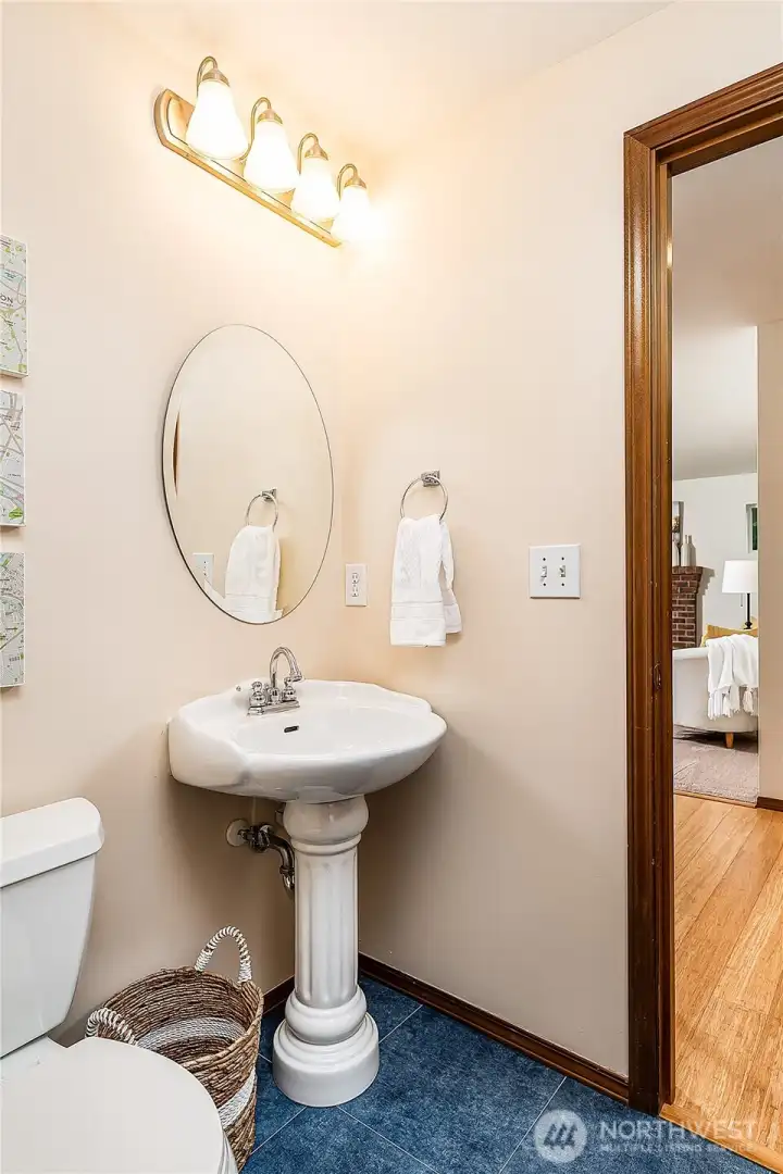 Downstairs powder room has been recently updated. Tile floor.