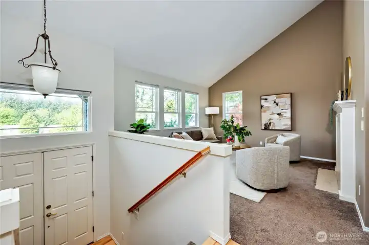 Vaulted ceilings and an abundance of natural light welcome you into the large living room, with fire place. New carpet in the home.
