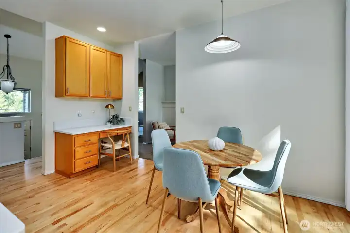 The wood floors were refinished late 2024. The eat-in kitchen opens into the backyard via large slider.