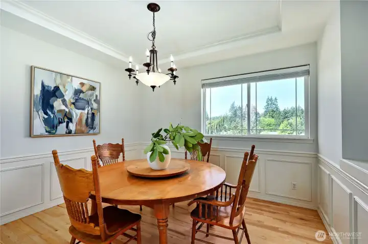 The dining room is elegant, with a cocktail counter and storage.