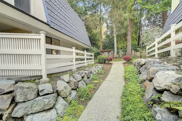 There are no steps to climb to reach this ground floor condo home.....just follow the path up to the bushes and turn left.  Enter the front door and #1315 is the corner home on the right.