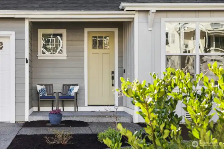 A cozy, welcoming entry invites you in, perfectly poised for spring blooms to frame the front porch. Thoughtful details and a charming sitting area create a warm first impression and a peaceful place to pause.