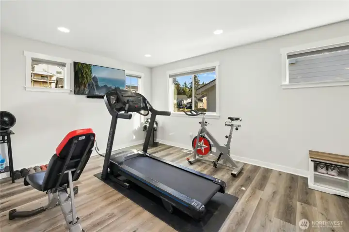 The bonus space at the top of the stairs is bright and versatile—perfect as a home gym, media room, or play space. With recessed lighting, multiple windows, and plenty of open floor area, it’s an ideal flex space to fit your lifestyle