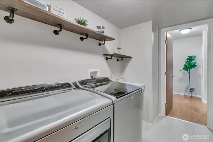 Laundry room w/utility sink. W&D stay