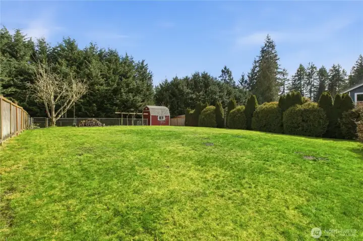 Fully fenced backyard, sprinkler system front & back