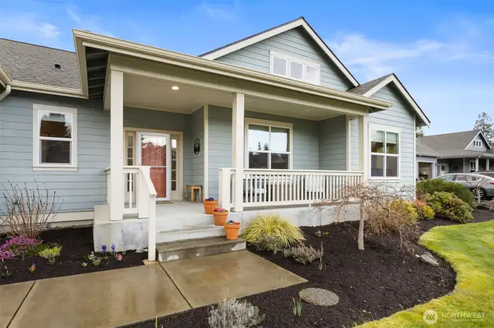 The cozy covered front porch welcomes you home.