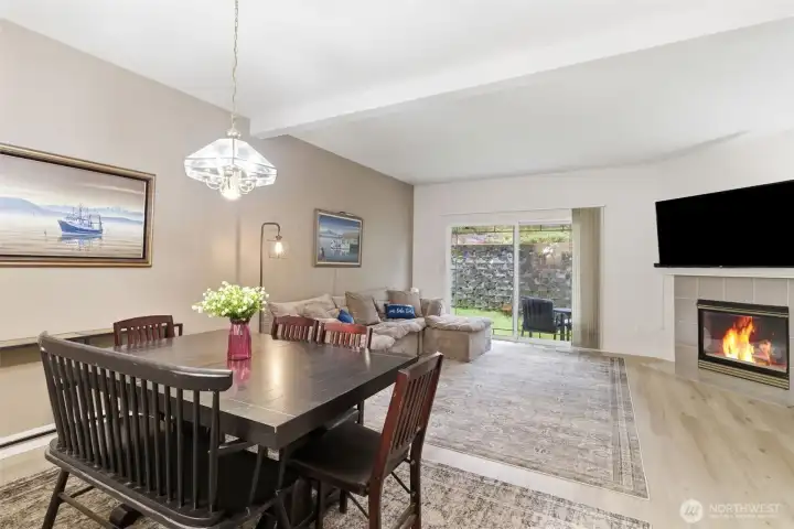 Dining area with roomy living room and private patio.