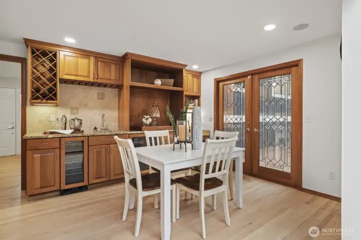 Eating space off kitchen with french doors to deck and wet bar for entertaining. This space could also be used as a lovely sitting area.