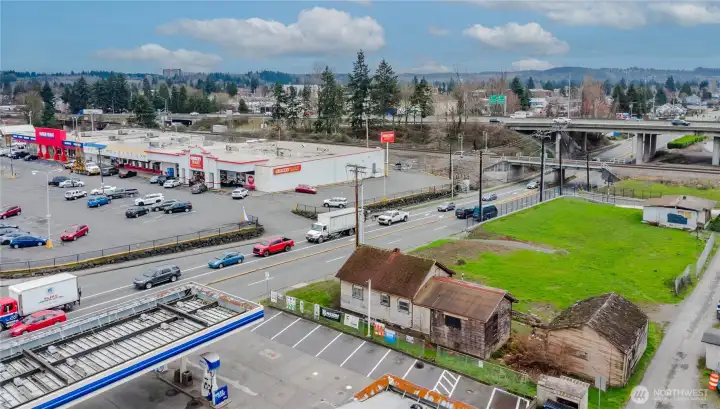 Across from major grocer and next to Arco.