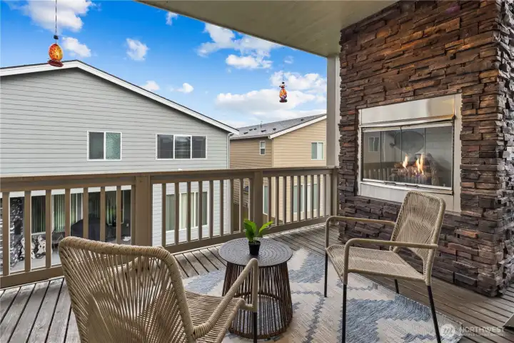 Step on to your covered patio and cozy upto the outdoor gas fireplace