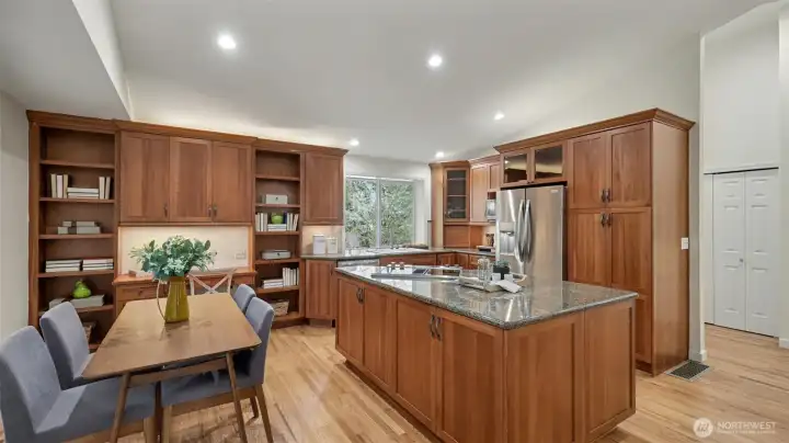 Dining space with beautiful built-in desk area and custom shelving.