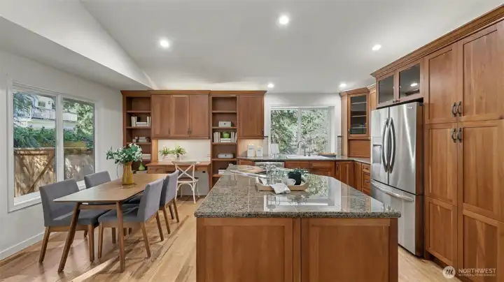 Cabinetry with pullout drawers and glass upper accents.