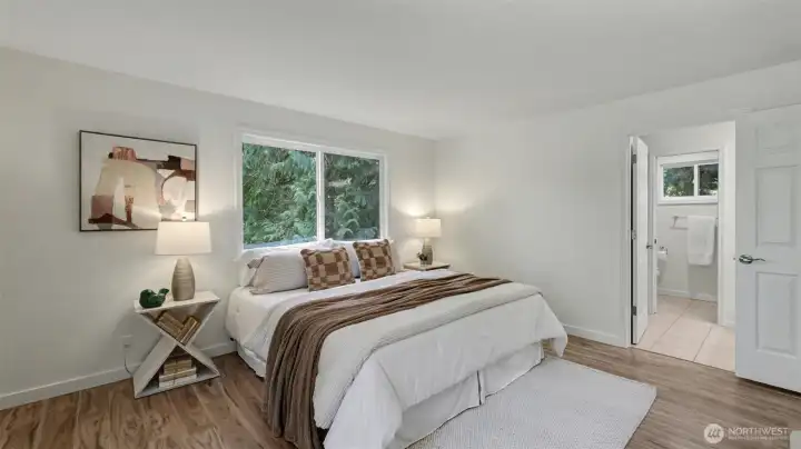 Luxury vinyl plank flooring newly installed throughout the upper and lower levels of the home.