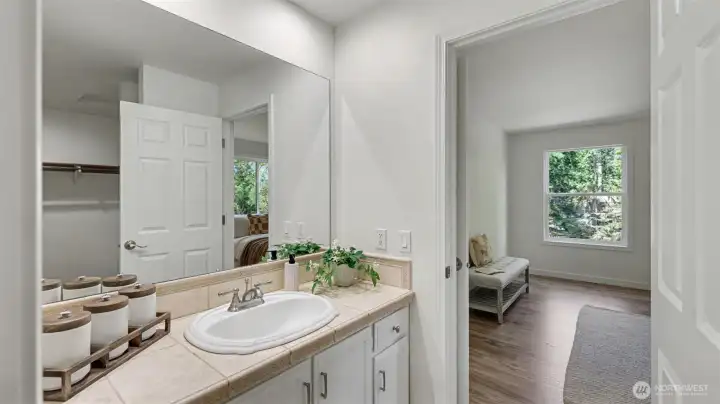 Large walk-in closet seen in the mirror.