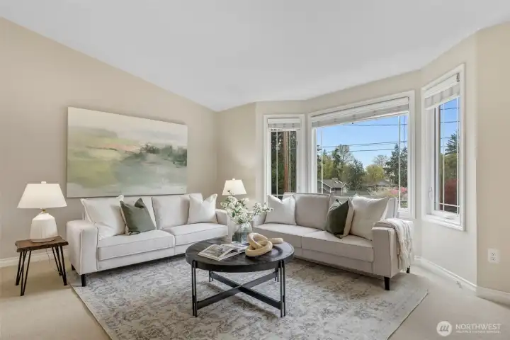 Vaulted ceilings and big picture windows lighten the Living Room