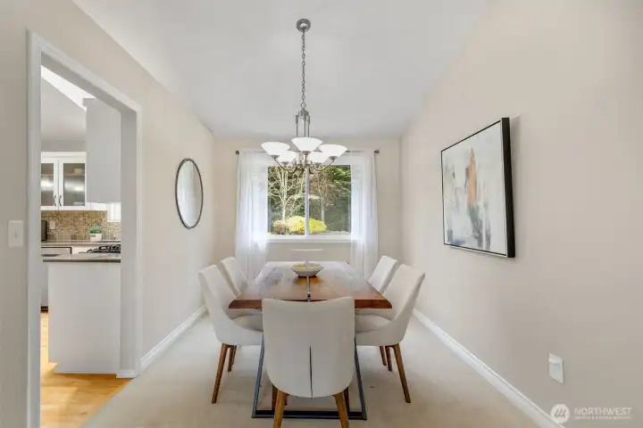 Gather with friends around the table. View towards the backyard.