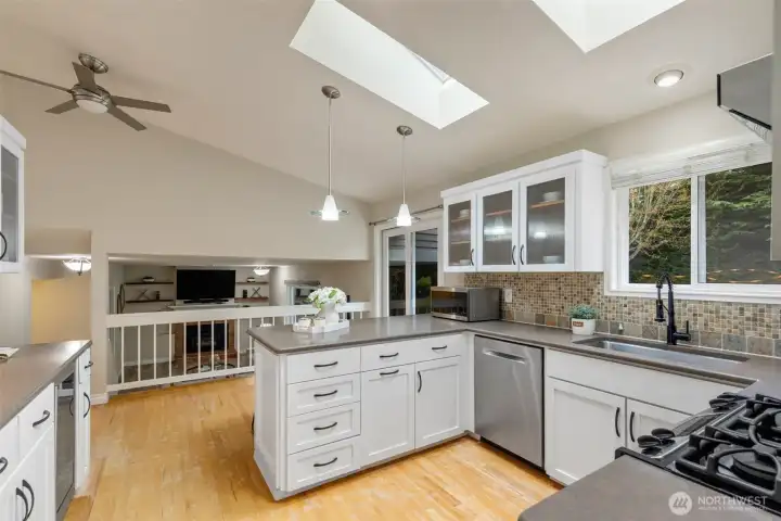 Skylights, quartz countertops in this wonderfully remodeled kitchen