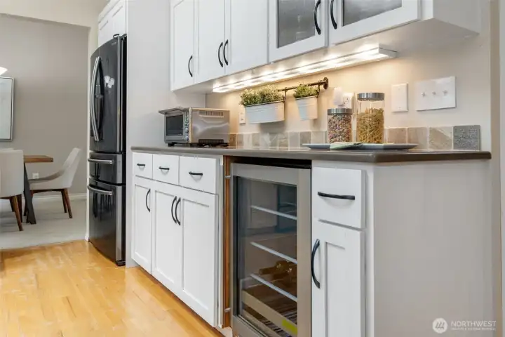 Undercabinet lighting and beverage fridge are a few of the daily luxuries in the home.