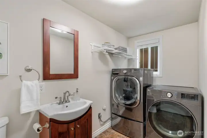 The powder room and laundry room on the lower level.