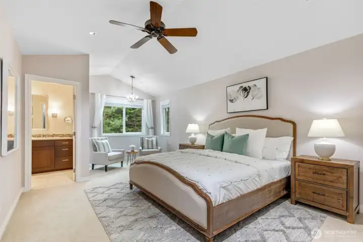 Peace and calm in the primary bedroom with space for a sitting nook or nursery.