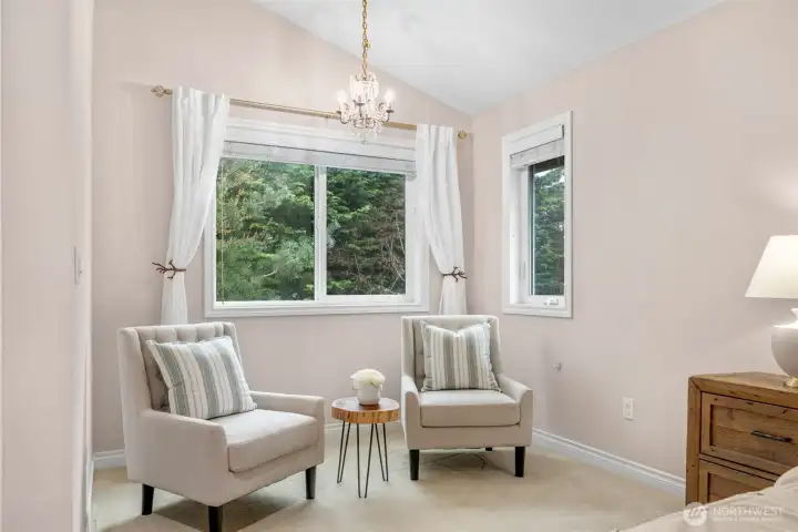 Designer color palette, sitting nook and vaulted ceilings with a view overlooking the private backyard.