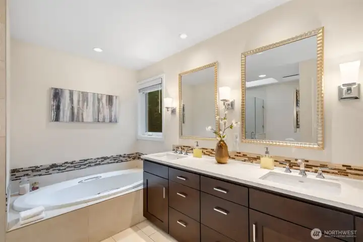 Dual vanities, heated floors, heated towel rack and soaking tub create a sanctuary.