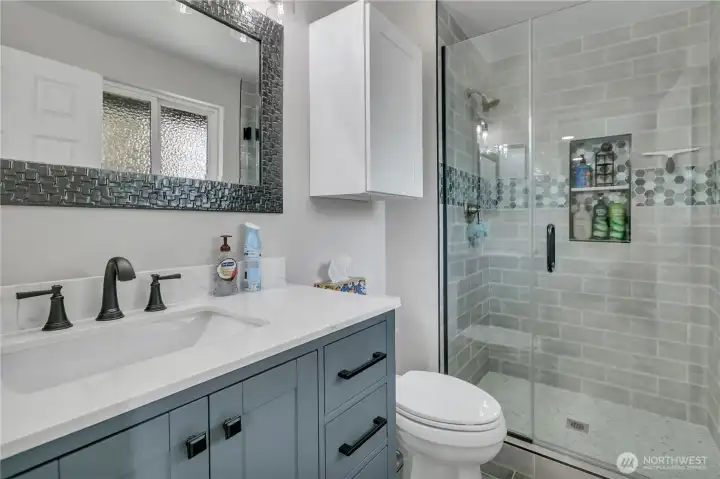 Updated primary bath with spa like shower