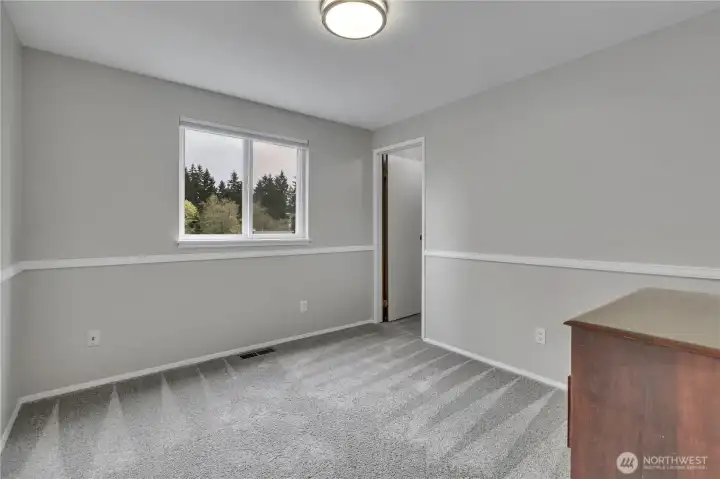 Secondary bedroom with walk in closet