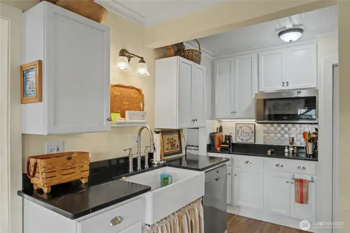 Kitchen area with convection oven and microwave on right
