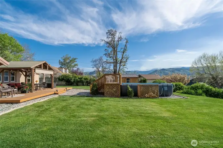 Back yard looking toward pool and storage shed
