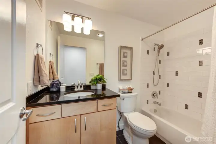 Full bath off hallway.