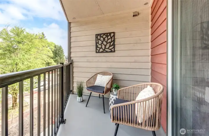 Cozy covered balcony with freshly painted floor.