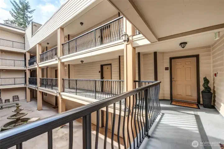 View of the courtyard. Entrance to unit is straight ahead.