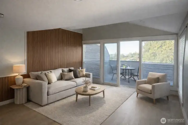 Living room with 10’ ceilings, expansive westerly views of Lake Washington and the Olympic Mountains. Sound insulating architectural slat wall feature. Living room with 10’ ceilings, expansive westerly views of Lake Washington and the Olympic Mountains. Sound insulating architectural slat wall feature.