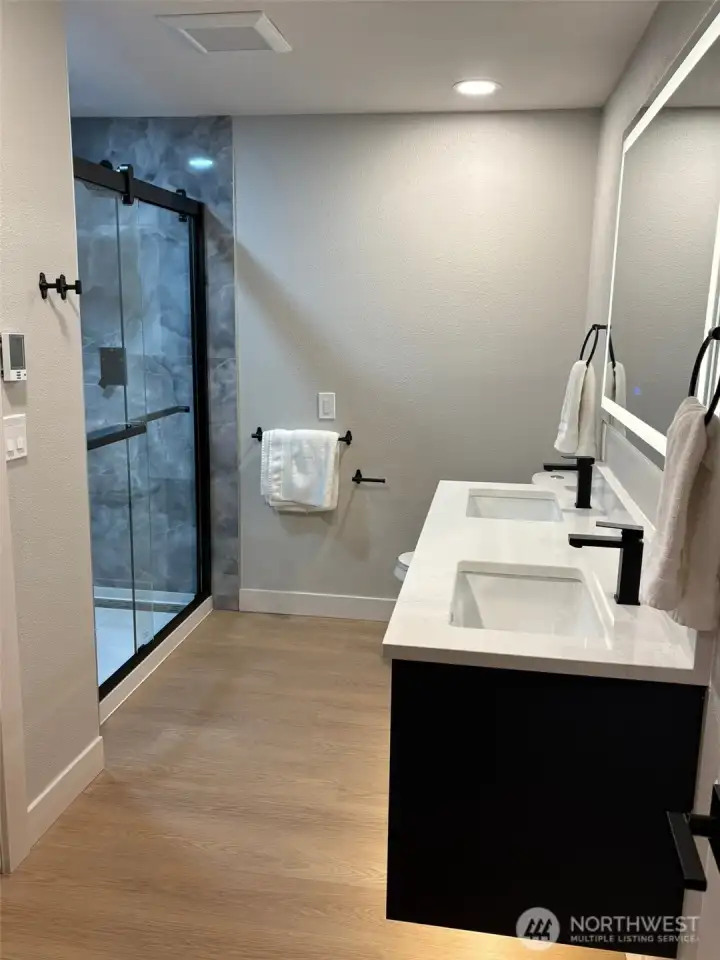 Large Jack-n-Jill bathrooms with new oversized double-sink floating vanity, under-cabinet ambience lighting, lighted dimmable LED mirror, programmable heated flooring. Shower with 3-way rainfall, shower head, adjustable wand. Beautiful custom shower with floor-to-ceiling tile, soft-close shower doors, large shampoo niche, corner bench. Ultra-quiet low dBA Panasonic fans on timers. Large Jack-n-Jill bathrooms with new oversized double-sink floating vanity, under-cabinet ambience lighting, lighted dimmable LED mirror, programmable heated flooring. Shower with 3-way rainfall, shower head, adjustable wand. Beautiful custom shower with floor-to-ceiling tile, soft-close shower doors, large shampoo niche, corner bench. Ultra-quiet low dBA Panasonic fans on timers.