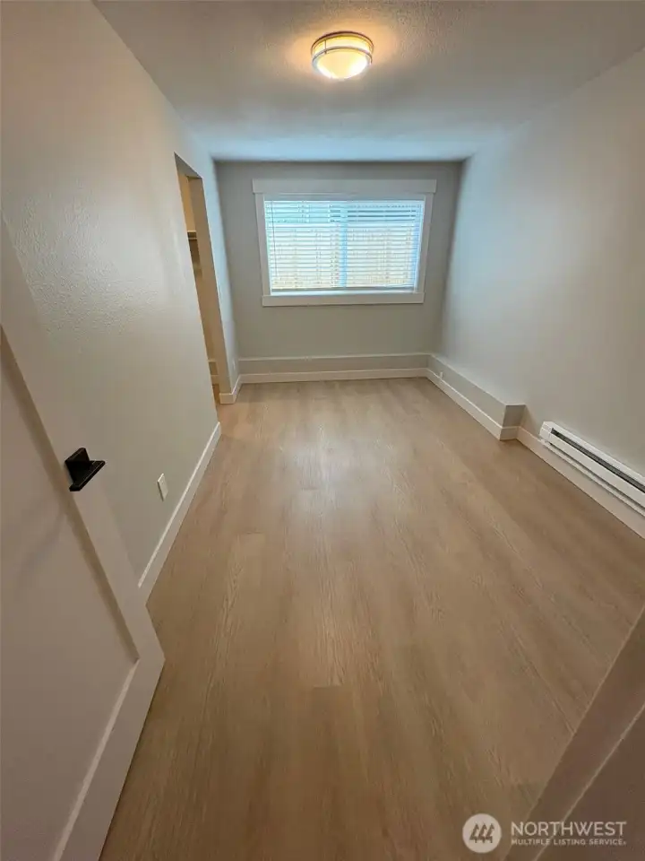 Second bedroom with walk-in closet organizer Second bedroom with walk-in closet organizer