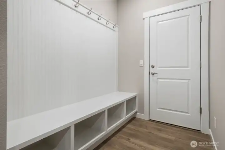 Mudroom area with built-in bench seating. Photos are representative only and may display different color packages and/or upgrades. Mudroom area with built-in bench seating. Photos are representative only and may display different color packages and/or upgrades.