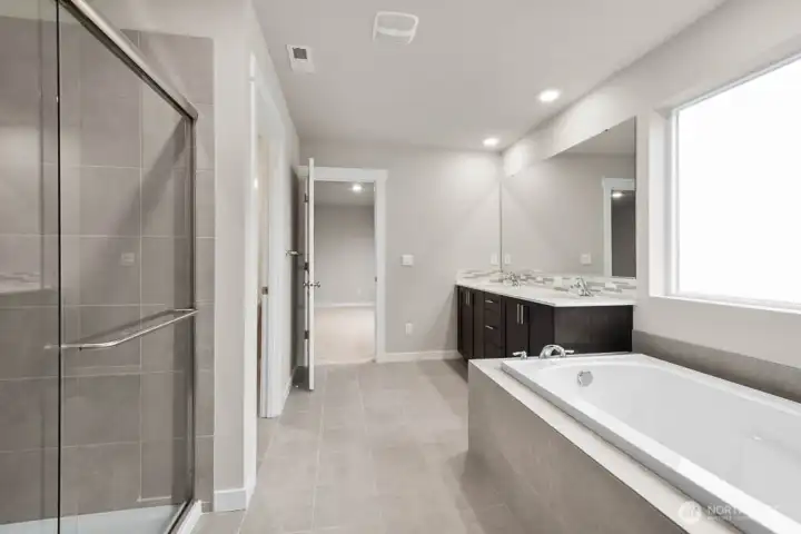 Luxurious primary bathroom. Photos are representative only and may display different color packages and/or upgrades. Luxurious primary bathroom. Photos are representative only and may display different color packages and/or upgrades.