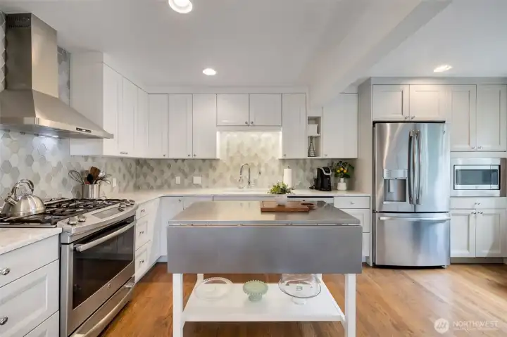 Spacious remodeled kitchen opens to dining and living area Spacious remodeled kitchen opens to dining and living area