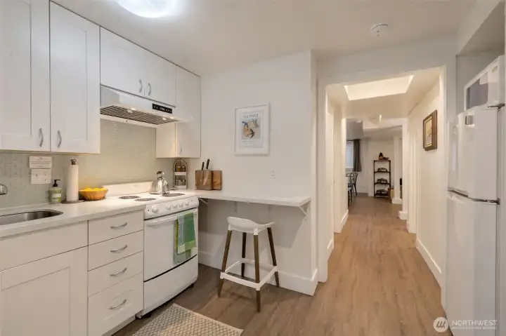 ADU kitchen with hallway to living-dining-sleeping areas ADU kitchen with hallway to living-dining-sleeping areas