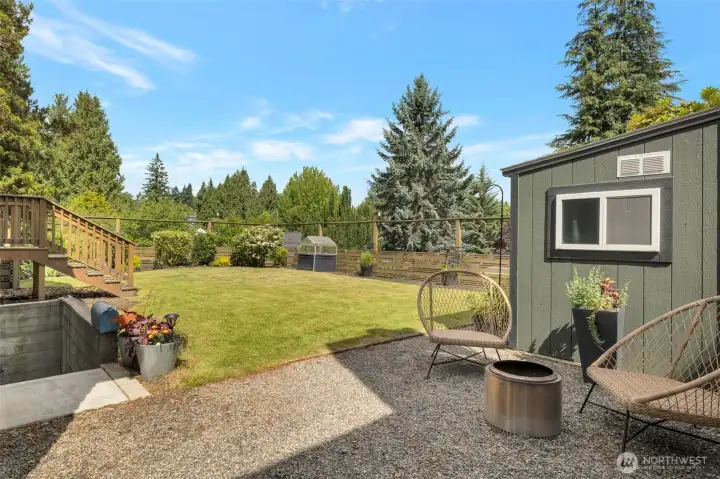 Backyard with garden shed and stairway down to separate ADU entry Backyard with garden shed and stairway down to separate ADU entry