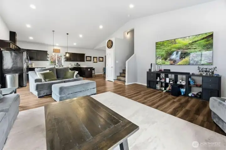Spacious living room flows seamlessly into the kitchen, creating an ideal layout for entertaining and family gatherings.