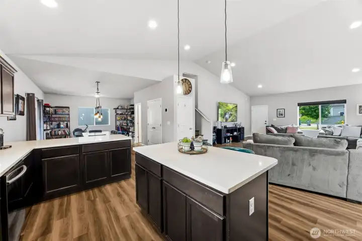 Large island, abundant cabinetry, spacious double-door pantry, and open dining area make this kitchen the heart of the home.